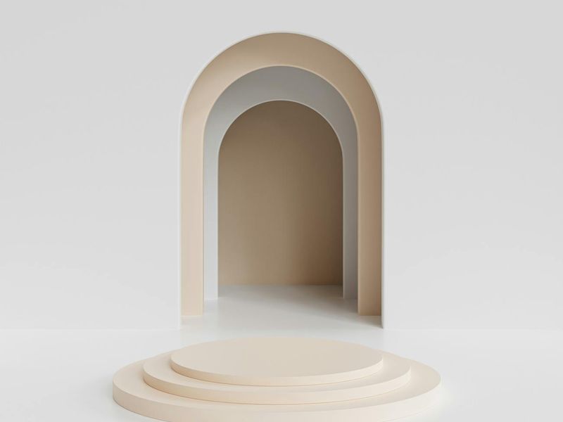 Bright morning light entering a minimalist studio space.